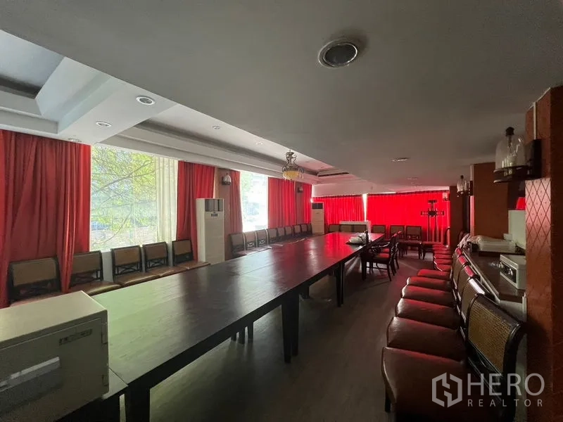 Retail Space for rent or sale in Khlong Toei, Bangkok - Private dining or meeting room with long table and red curtains.