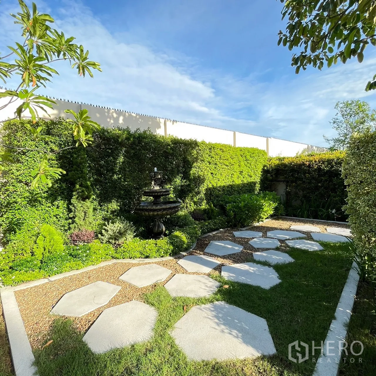 Detached House for rent or sale in Bang Khen, Bangkok - Rear garden with stepping‑stone path and classic fountain.
