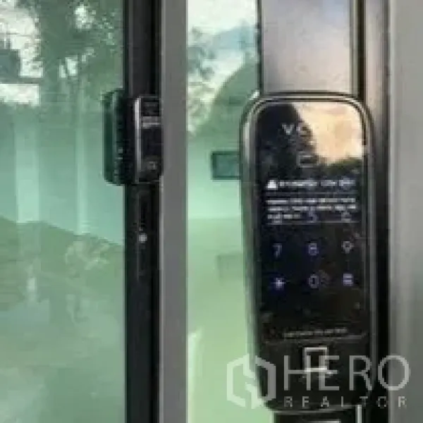 Home Office for rent in Don Mueang, Bangkok - Digital door lock keypad on a glass door for secure entry.