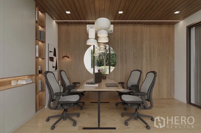 Detached House for rent in Saphan Sung, Bangkok - Home office with long table, ergonomic chairs and a round window to the garden.