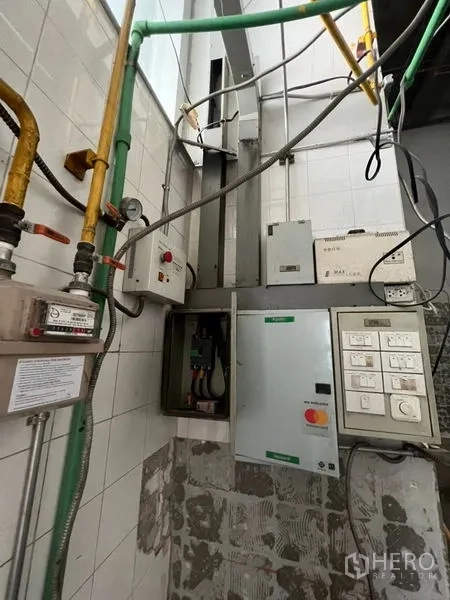 Retail Space for rent in Sathon, Bangkok - Back-of-house service room featuring electrical panels, pipes and meters.
