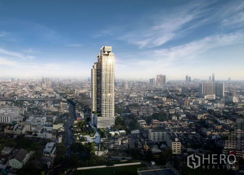 Condominium for sale in Bang Kho Laem, Bangkok - Aerial view of a modern high-rise condominium tower rising above the cityscape.