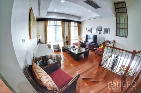 Detached House for rent in Watthana, Bangkok - Upstairs family room with TV area, large windows and warm timber flooring.