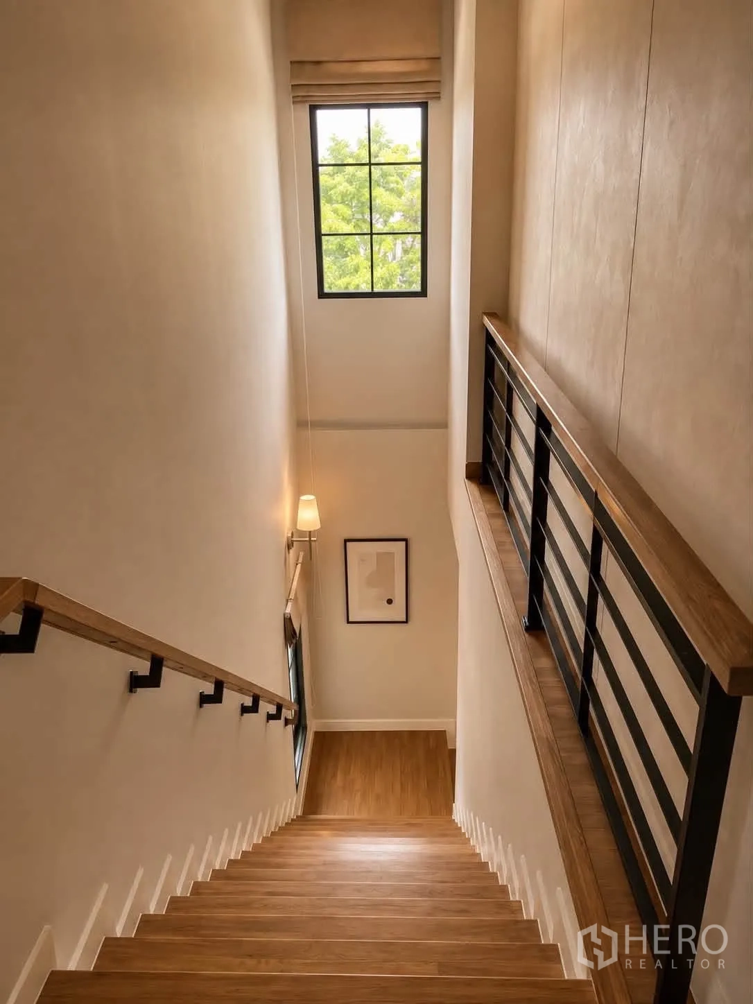 Detached House for rent in Bang Phli, Samut Prakan - Stairwell with wooden steps, handrails and a tall window.