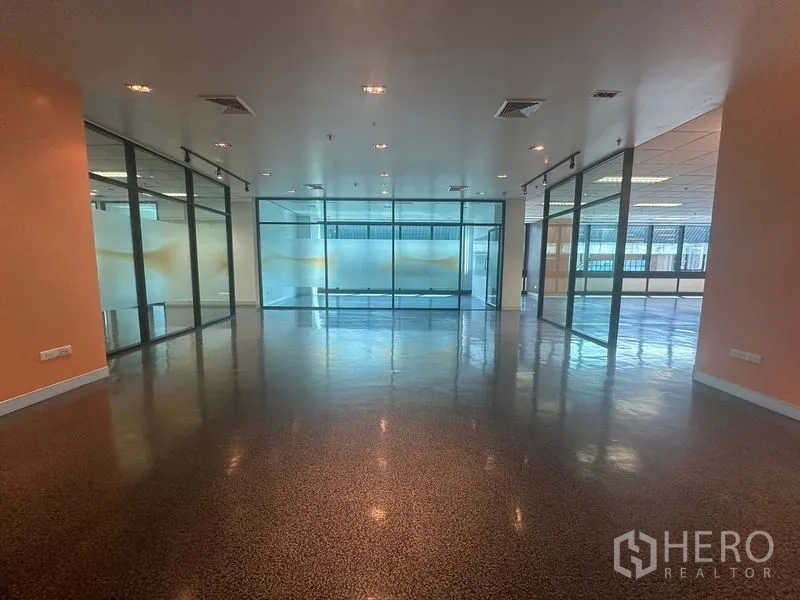 Office Space for rent in Khlong Toei, Bangkok - Lobby zone with wide glass partitions dividing meeting rooms from the work area.