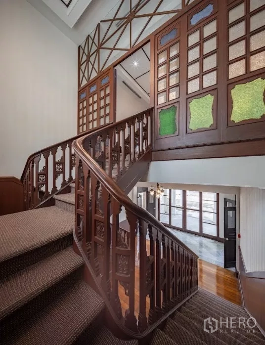 Retail Space for rent in Bang Rak, Bangkok - Ornate wooden staircase with decorative panels and colored glass details
