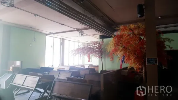 Retail Space for rent in Watthana, Bangkok - Spacious dining-style area with bench seating, large windows, and an industrial open ceiling.
