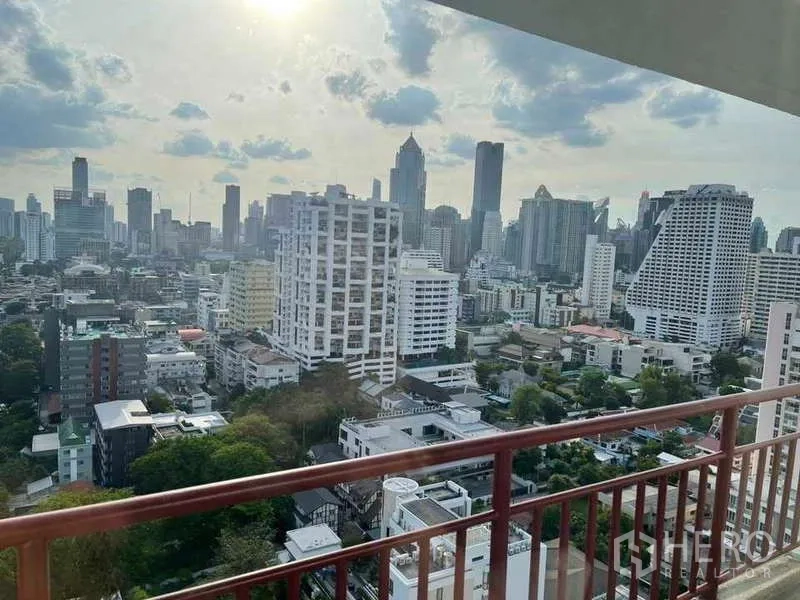 Condominium for rent or sale in Khlong Toei, Bangkok - Private balcony with red railing overlooking Bangkok skyline and cityscape