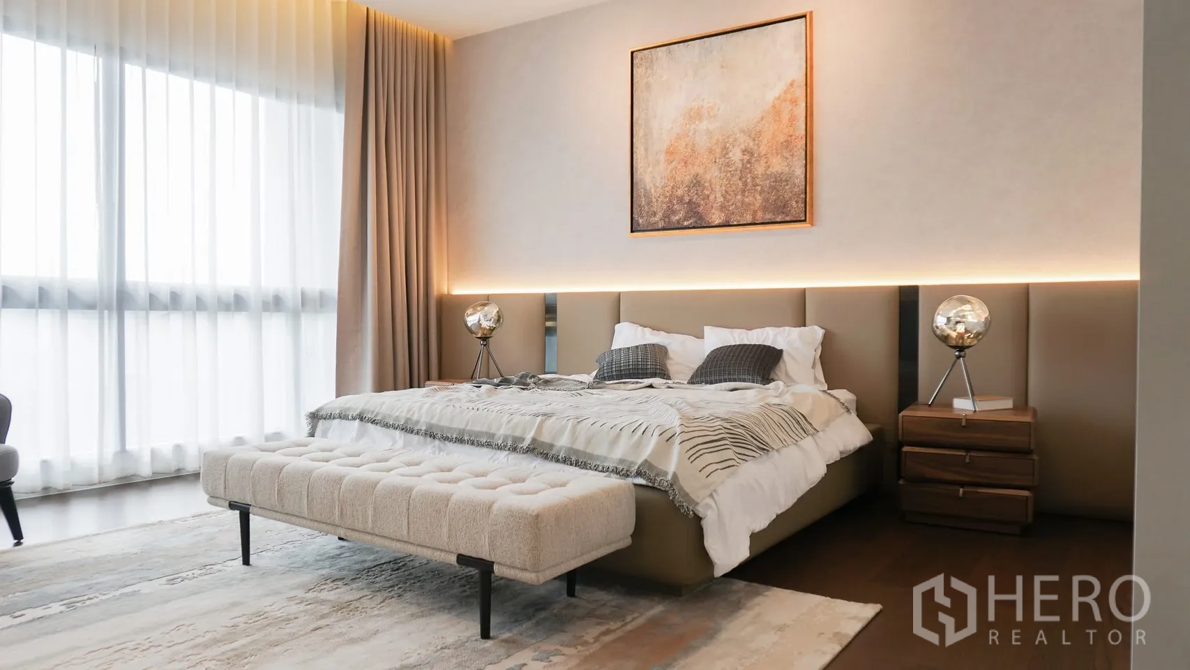 Detached House for rent or sale in Bang Kapi, Bangkok - Bedroom with adjacent vanity nook featuring a backlit mirror.