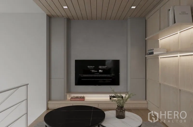 Detached House for rent in Saphan Sung, Bangkok - Cozy mezzanine lounge with round coffee table, TV and light‑wood shelving.