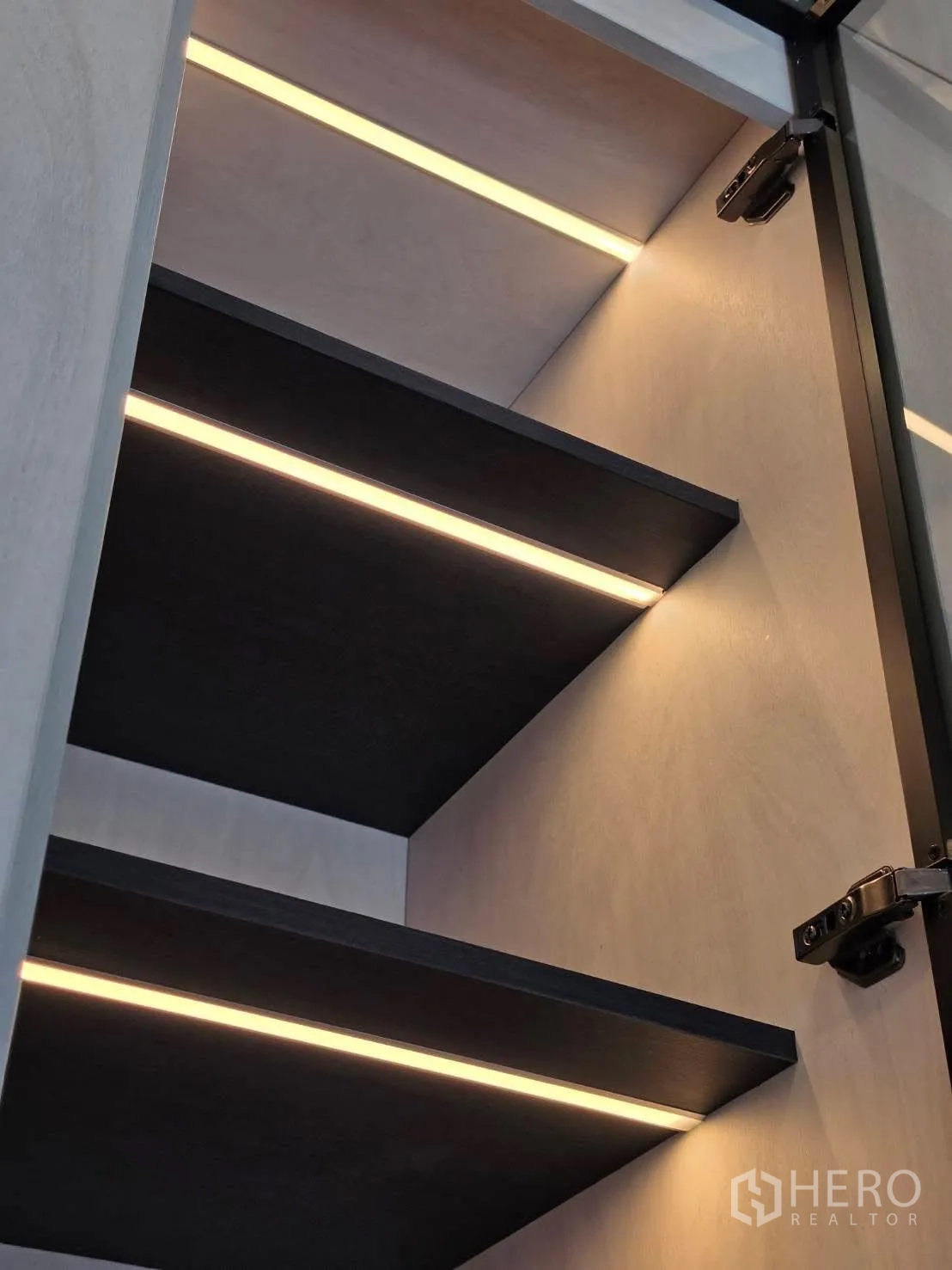 Detached House for rent in Bang Phli, Samut Prakan - Close-up of cabinet shelves with integrated LED lighting.