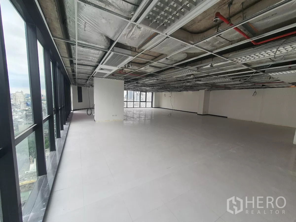 Office Space for rent in Bang Rak, Bangkok - Long bank of windows giving skyline views across Bang Rak from an upper floor.