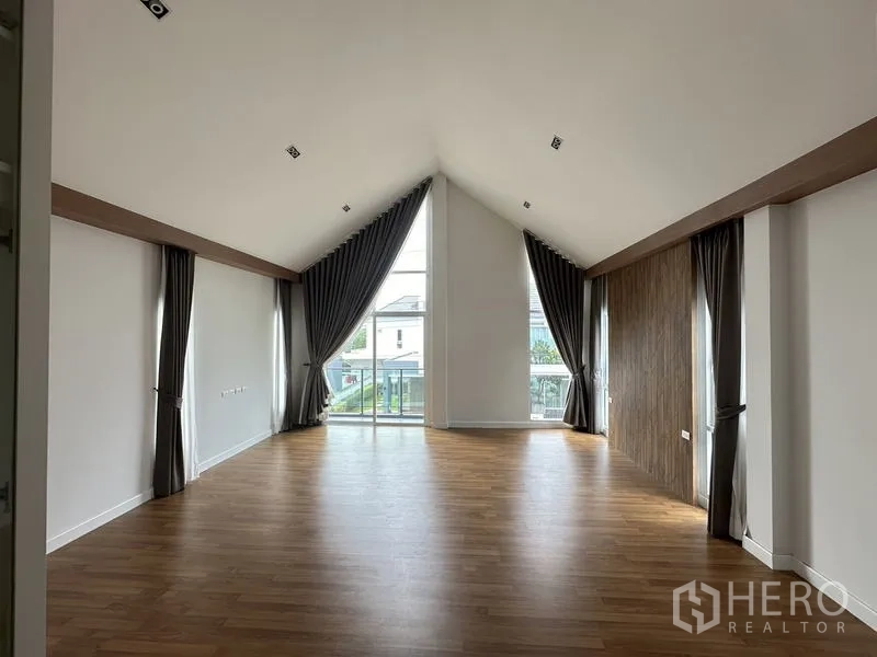 Detached House for sale in Lam Luk Ka, Pathum Thani - Bright master bathroom with white tiled walls, shower and vanity.