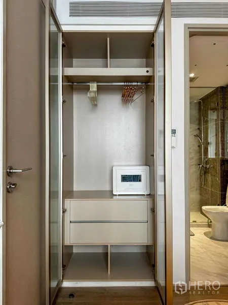 Condominium for rent - Open wardrobe with drawers, hanging space and an in‑room digital safe.