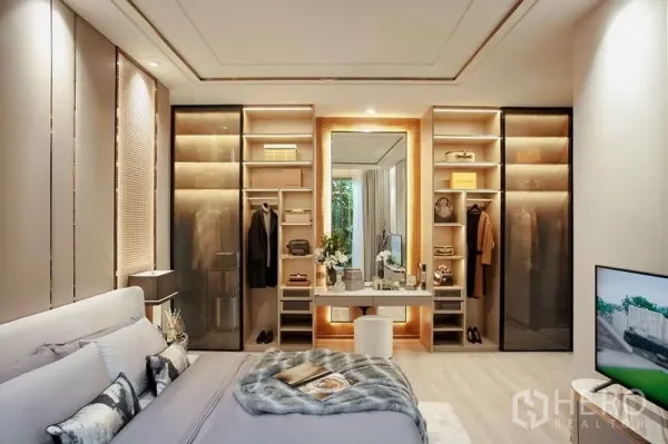 Condominium for sale in Bang Kho Laem, Bangkok - Master bedroom with built-in wardrobes, lighted vanity and warm contemporary finishes.