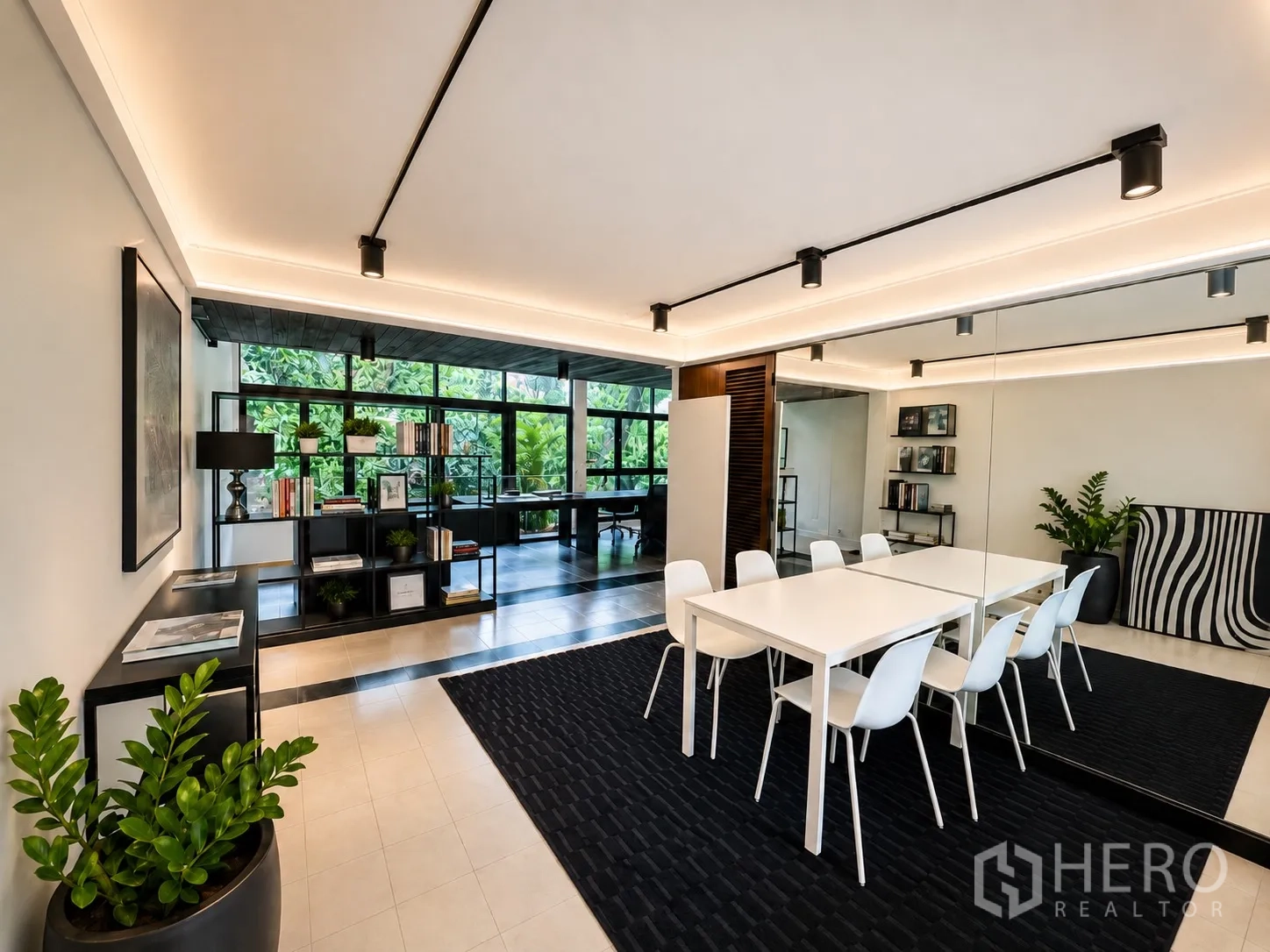 Office Space for rent in Phaya Thai, Bangkok - Bright meeting room with white table and chairs, mirror wall, and shelving.