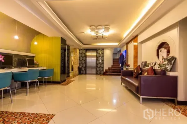 Retail Space for rent - Bright lobby area featuring elevators, seating and computer desks for customers.