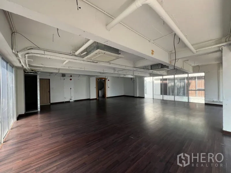 Retail Space for rent in Watthana, Bangkok - Spacious corner retail space with wraparound glazing, AC ducting and multiple access points, ready for custom fit-out.