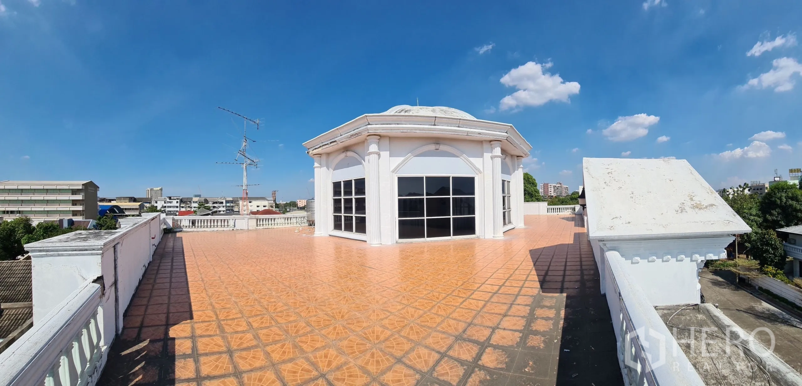 Detached House for sale in Chatuchak, Bangkok - Rooftop terrace with octagonal pavilion and city views under blue sky.