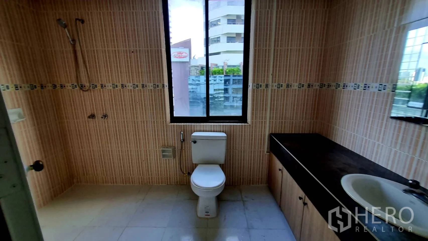 Condominium for rent in Watthana, Bangkok - Master bedroom with king bed, wardrobes and balcony access.