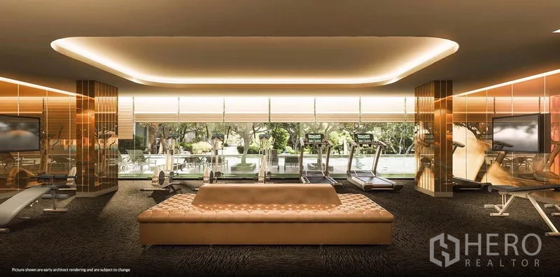 Condominium for rent in Khlong Toei, Bangkok - Modern fitness center with cardio machines and weights overlooking greenery.