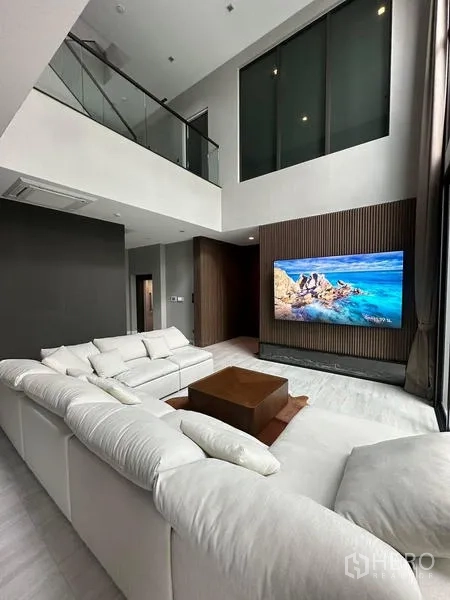 Detached House for rent in Saphan Sung, Bangkok - Another view of the airy double-height living space and mezzanine.