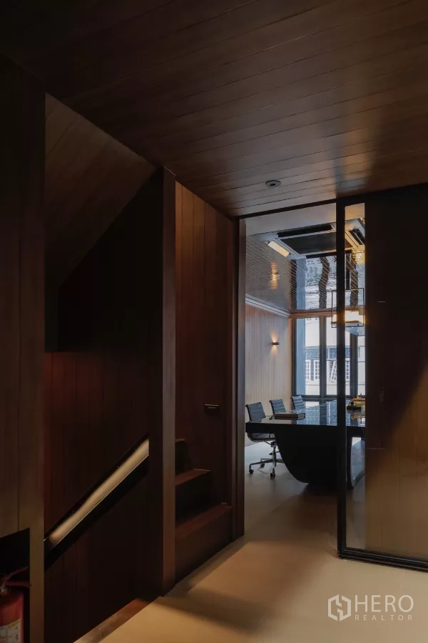 Office Space for rent in Bang Rak, Bangkok - Hallway with stairs leading to a glass‑enclosed meeting room
