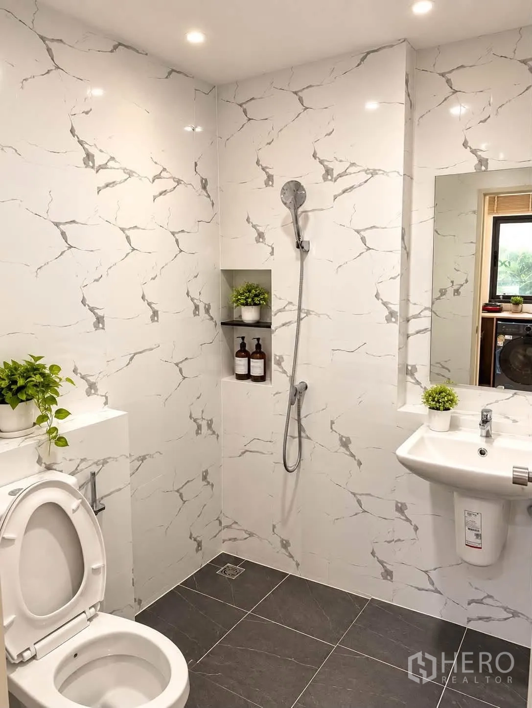 Townhouse for rent in Bang Phli, Samut Prakan - Another angle of marble-pattern bathroom showing toilet, sink, and recessed shelf.