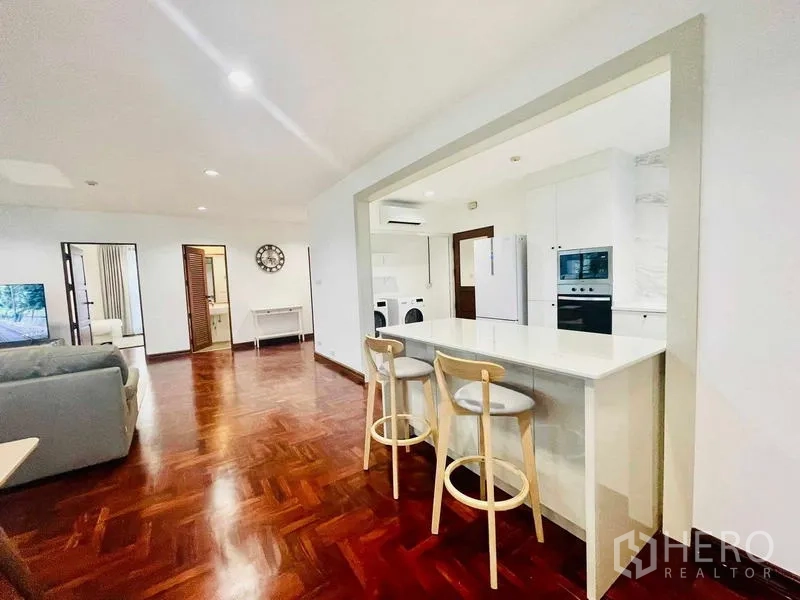 Condominium for rent - Kitchen pass-through counter and breakfast bar opening to the living area.