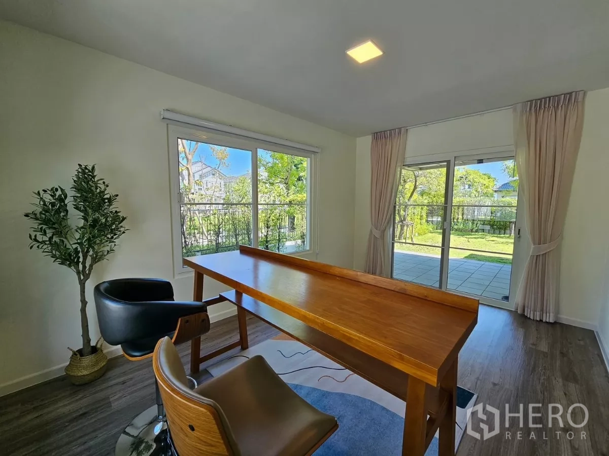 Detached House for rent in Bang Phli, Samut Prakan - Multipurpose room with large windows and sliding doors to a tiled patio and lawn.