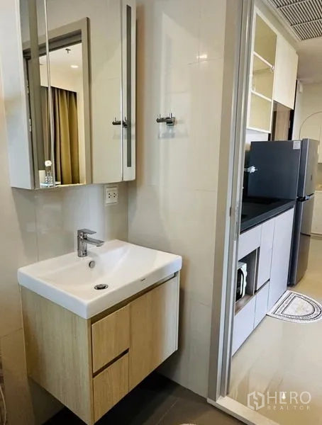 Condominium for rent - Vanity sink area next to the kitchen leading toward the bathroom.