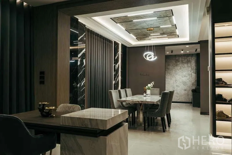 Detached House for sale in Sai Mai, Bangkok - Open‑plan dining and foyer with coffered ceiling and illuminated display shelves.