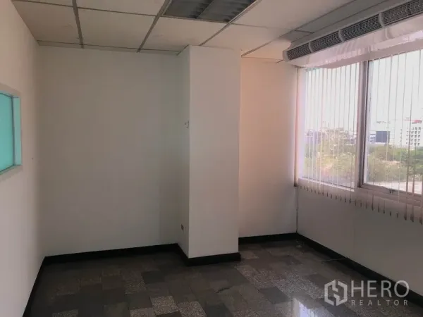 Office Space for rent in Khlong Toei, Bangkok - Windowed workspace with natural light, ceiling air vents above the windows and durable tile flooring.