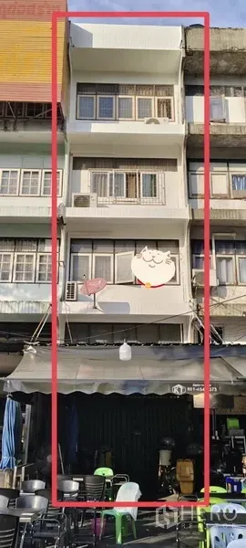 Shophouse for sale in Watthana, Bangkok - Four-and-a-half-storey shophouse facade in Ekkamai with balconies and a street awning highlighted.