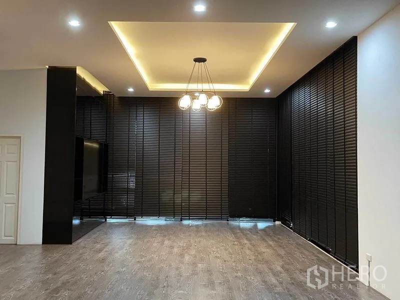 Office Space for rent in Bang Na, Bangkok - Spacious hall with recessed ceiling lights, modern chandelier and dark slatted blinds.