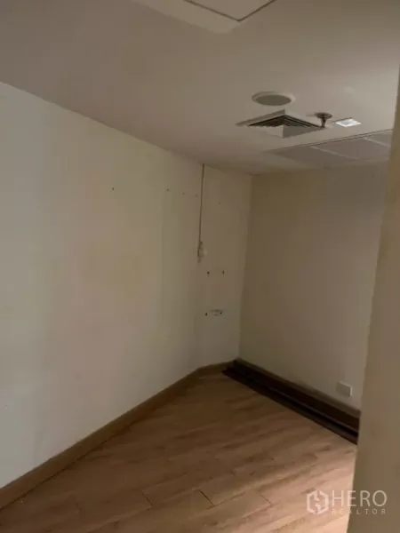 Office Space for rent - Small office with wood floors, ceiling vents and recessed lighting.