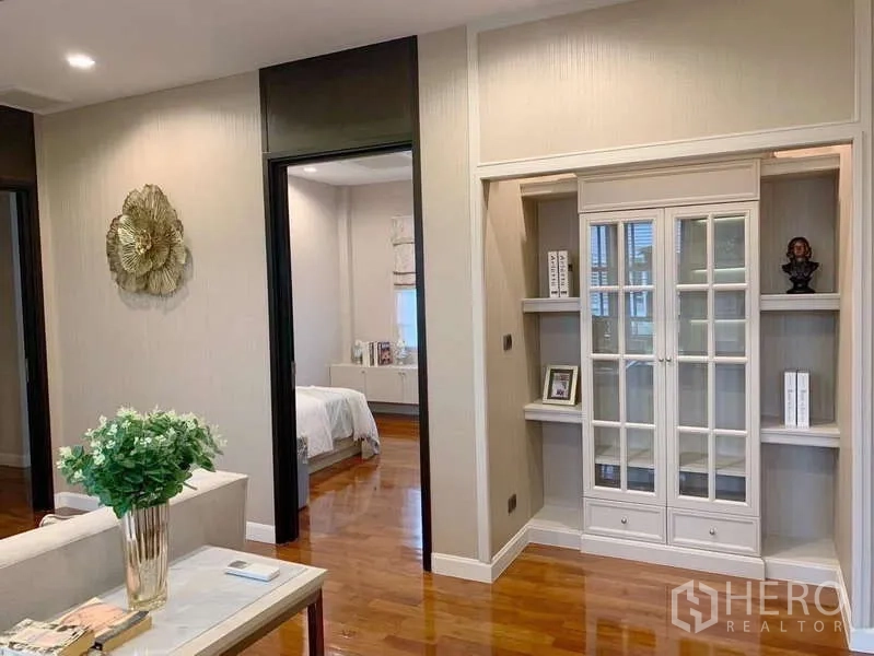Detached House for rent or sale in Bang Phli, Samut Prakan - Upstairs landing with display cabinet, hardwood floors and access to bedrooms.