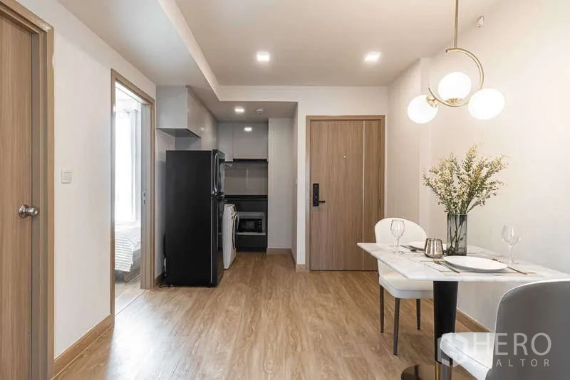 Condominium for rent - Entry corridor with dining nook leading to fitted kitchen and bedroom.