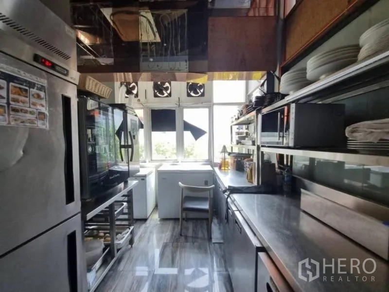 Retail Space for rent in Bang Rak, Bangkok - Stainless commercial kitchen with ovens, refrigerators and open shelving.