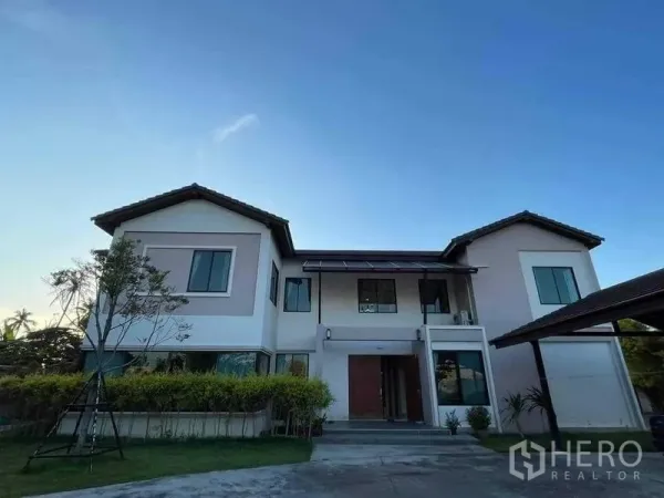 Warehouse for sale in Chon Buri - Modern two-storey office residence with large windows and central entry porch.