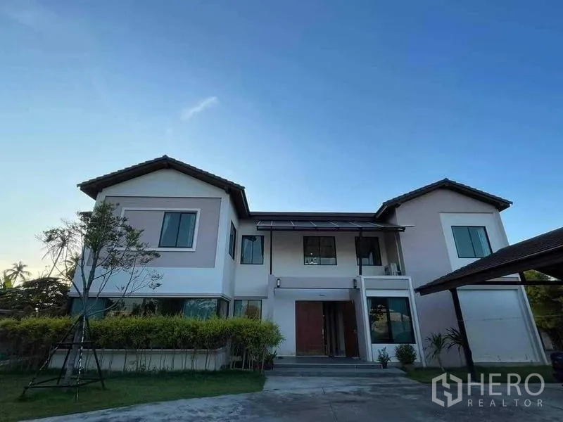 Warehouse for sale in Chon Buri - Modern two-storey office residence with large windows and central entry porch.