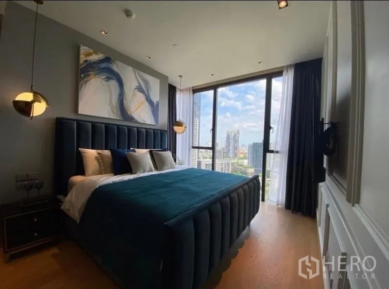 Condominium for rent - Bedroom with floor‑to‑ceiling windows flooding the room with light and panoramic Bangkok skyline.