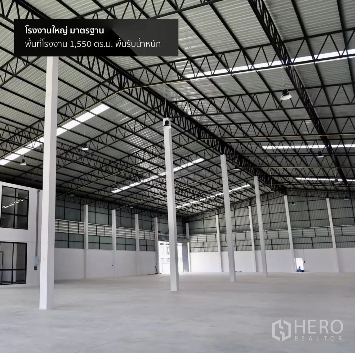 Factory for rent or sale in Phutthamonthon, Nakhon Pathom - Spacious warehouse interior featuring high steel truss roof, white columns and concrete floor.