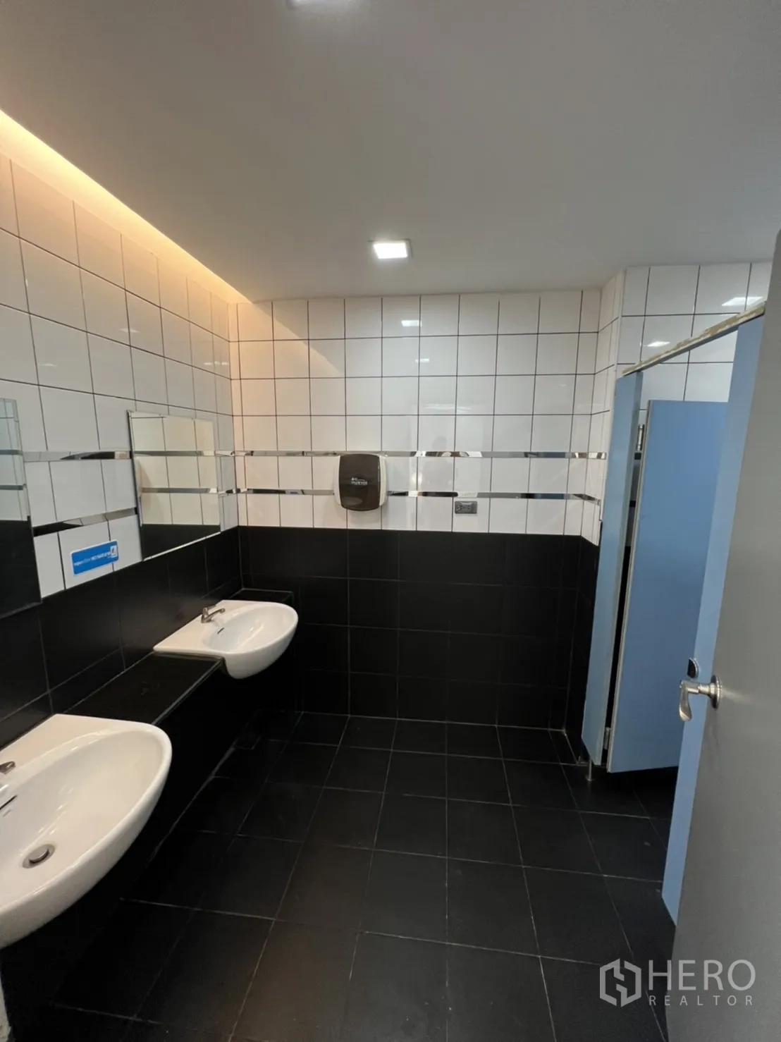 Retail Space for rent in Sathon, Bangkok - Bright washroom with twin basins and tiled walls.