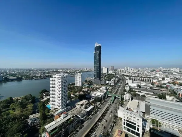 คอนโด ให้เช่าหรือขายในBang Kho Laem, Bangkok - ภาพวิวมุมสูงย่านบางคอแหลมและโค้งแม่น้ำเจ้าพระยาใต้ท้องฟ้าใส.