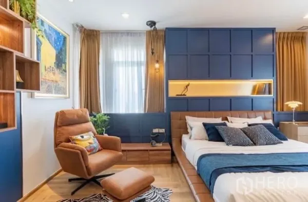 Detached House for rent in Bang Phli, Samut Prakan - Bedroom angle showing leather lounge chair, built-in shelves and large windows.