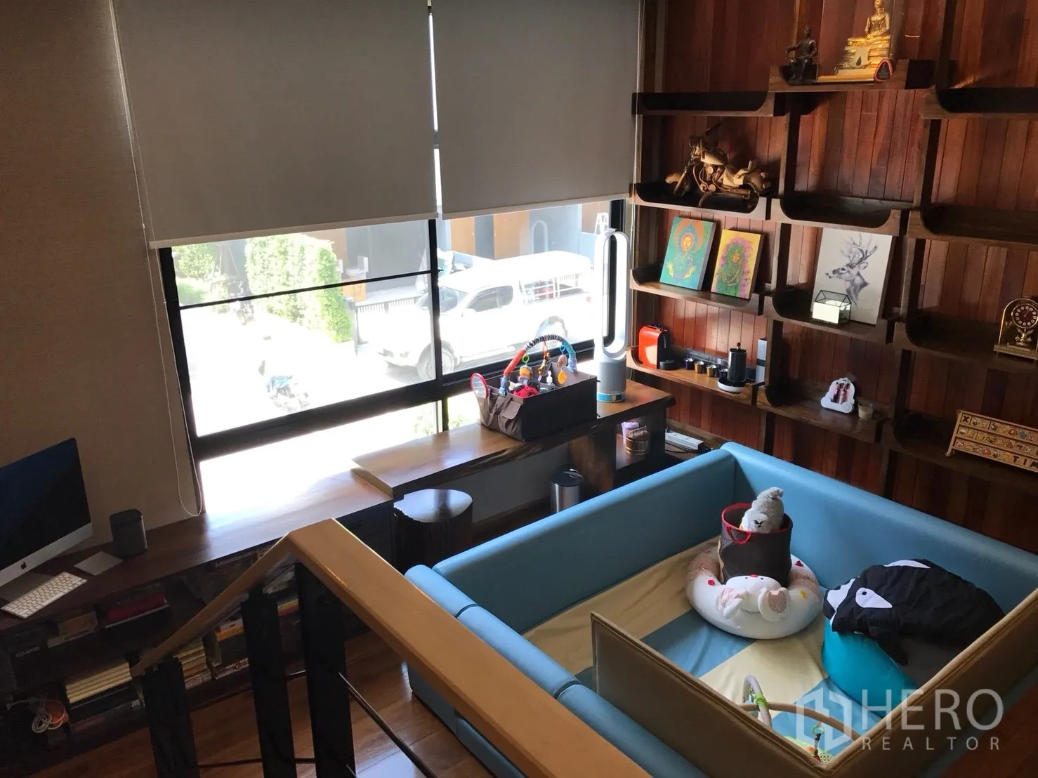 Townhouse for sale in Suan Luang, Bangkok - Mezzanine work area with large window, custom wooden shelving and play space