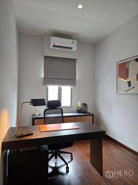 Detached House for rent or sale in Lat Krabang, Bangkok - Quiet home office with desk, task lamp, and a window.