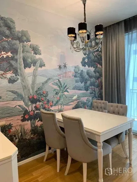 Condominium for sale in Watthana, Bangkok - Bright dining area beside sheer curtains, featuring a landscape wall mural and chic chandelier.