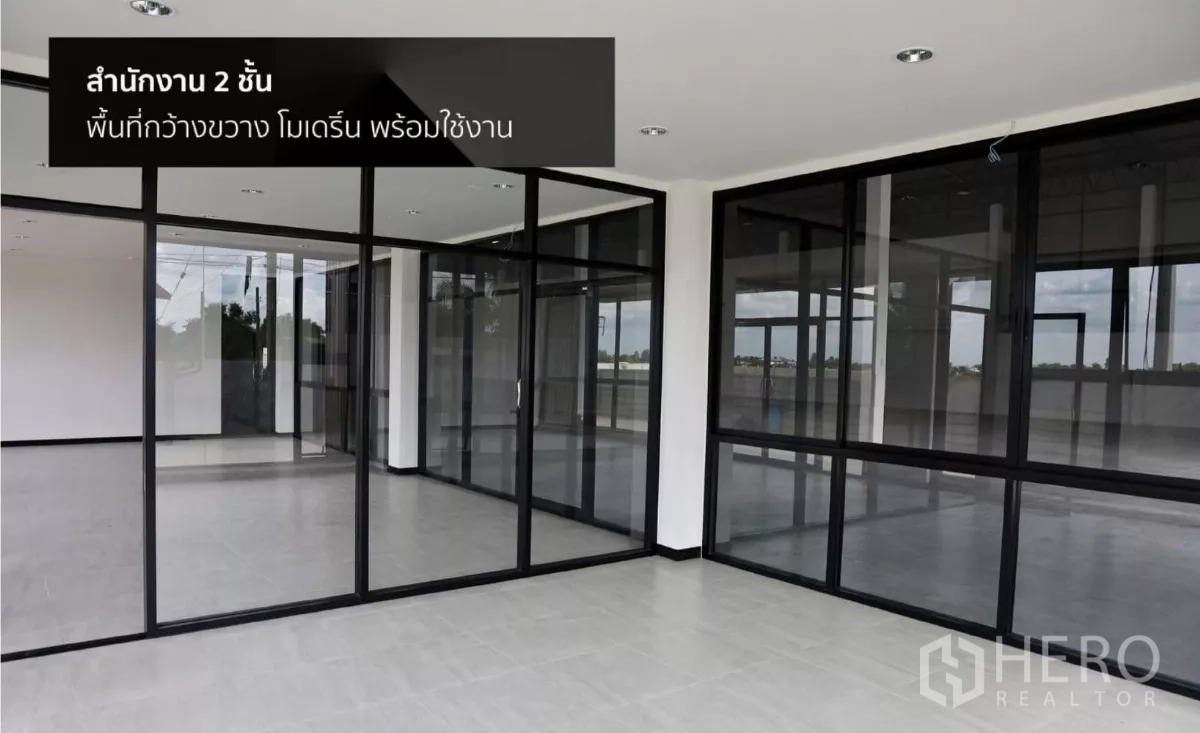 Factory for rent or sale in Phutthamonthon, Nakhon Pathom - Two-storey office interior with glass partitions and tiled flooring, ready for fit-out.